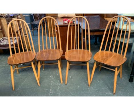 A set of four Ercol style beech stick back kitchen chairs 