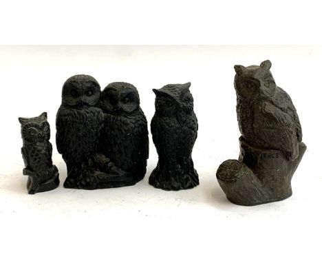 M W Pierce, a resin figure of an owl, signed, 9cm high; together with three other owl figurines (4) 