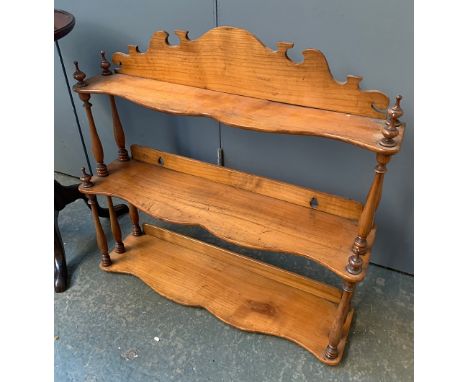 A 19th century three tiered spice rack, with turned supports, 56cmW 