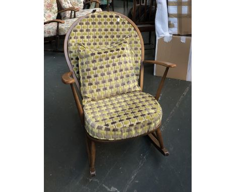 An Ercol 315 stickback rocking chair with geometric cushions 