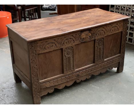 An elm and oak three panel coffer, with demilune carved frieze, 126x56x70cmH 