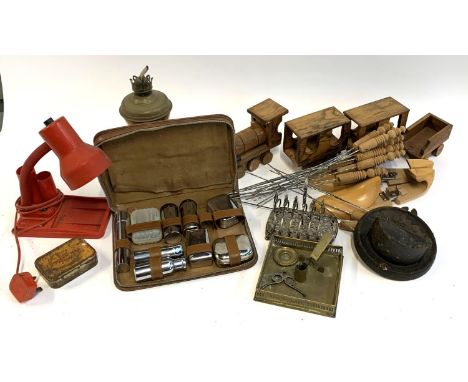 A mixed lot to include vintage desk lamp, toast rack (af), kebab skewers, wooden train, cased vanity set, coins, tin etc 