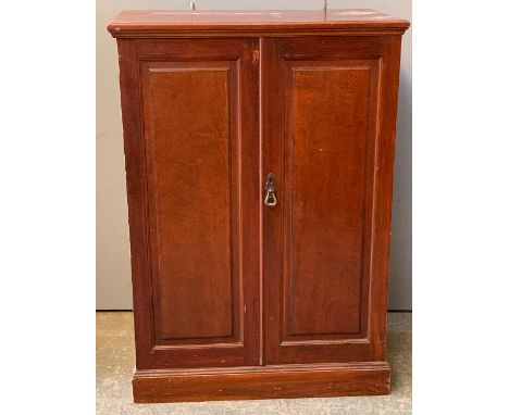 A Victorian mahogany cupboard, moulded top over two panel doors, opening to reveal three adjustable shelves, 77x43x108cmH 