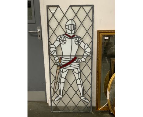 A leaded stained glass panel depicting a knight in armour, 130x51cm