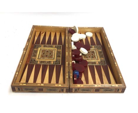 A parquetry and marquetry chess and backgammon board, with pieces, 50cmW