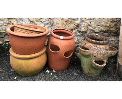 Two terracotta strawberry planters together with a further four terracotta plant pots 