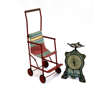 A vintage child's push along toy, together with a set of Dutch kitchen scales 