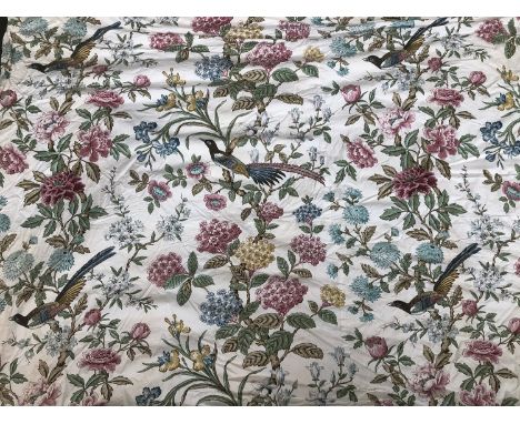 A pair of lined and interlined curtains, in an exotic bird print, 235cm wide ungathered, 270cm drop 