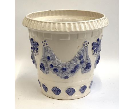 A blue and white ceramic planter with swags, 38cmH, 42cmD 