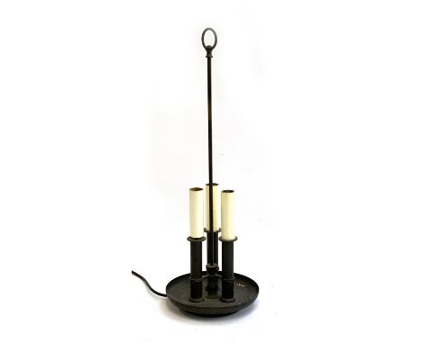 A brass table lamp with three candle style fittings 