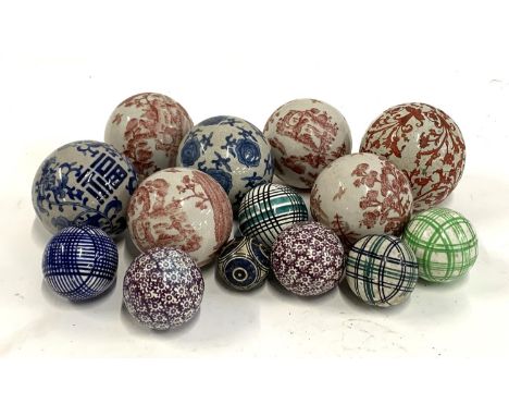 A quantity of decorative ceramic balls, to include four by India Jane decorated with red pastoral scenes, approx. 11cmD 