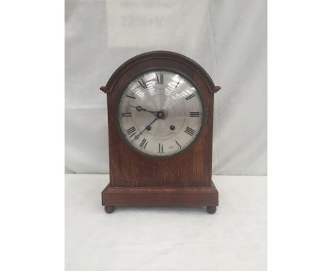 A mahogany mantel clock