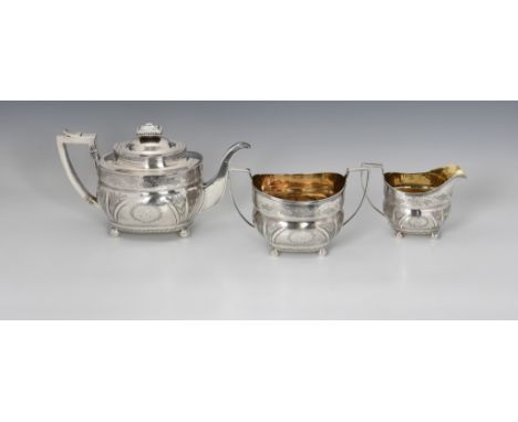 A George III silver three piece boat shaped tea tea service, William Hunter II, London, 1809, comprising teapot, twin handle 