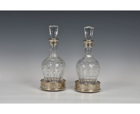 A pair of Elizabeth II silver mounted cut glass decanters, C J Vander Ltd, Birmingham, 1990, 11¾in. (30cm.) high, together wi