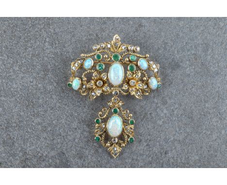 A 19th century style 18ct gold, opal, emerald and diamond pendant brooch, the openwork floral and foliate scroll brooch suspe