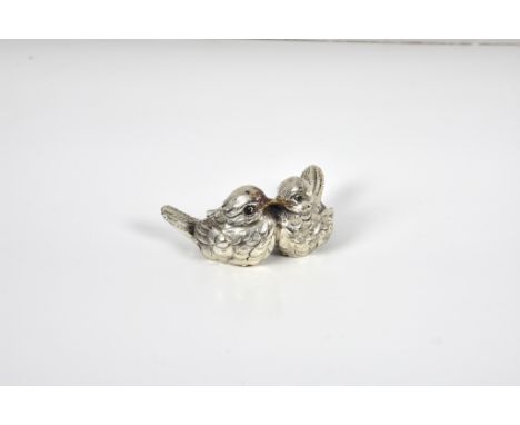 A silver model of little birds (filled), Import marks for P H Vogel &amp; Co, London, 1993, 3¼in. (8.3cm.) at widest. * Condi