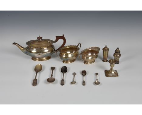 A George VI silver three piece tea service, William Neale &amp; Son Ltd, Birm.1946, of oval form with cut card rim and capped