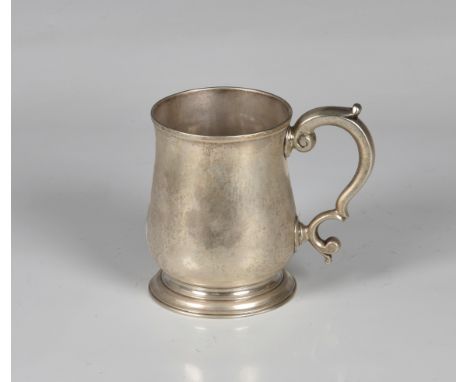 A George II silver half pint beer mug, John Barbe, London, 1755, of baluster form with slightly turned rim, s-scroll handle a