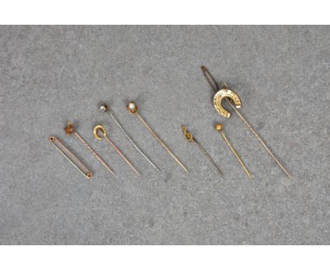 Eight antique stick and tie pins, (some gold), to include a 18ct gold foxes head &amp; 18ct gold miniature horseshoe, 9ct gol