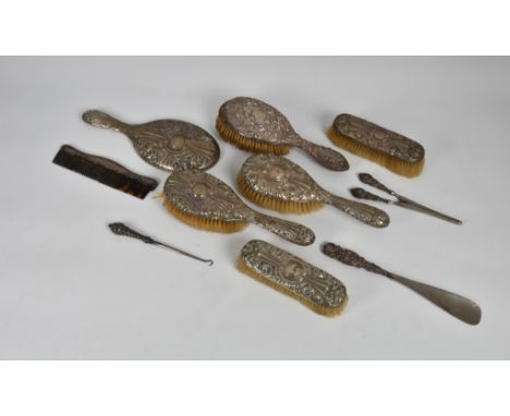 A Victorian five piece silver mounted brush set, A &amp; J Zimmerman Ltd, Birmingham, 1896, to include hand mirror, two hair 