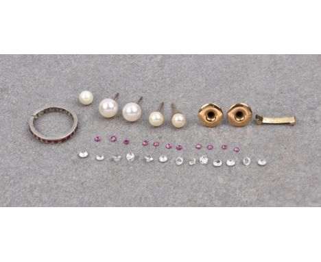 A platinum and ruby full eternity ring, has been cut, several of the rubies now loose; together with a small quantity of loos