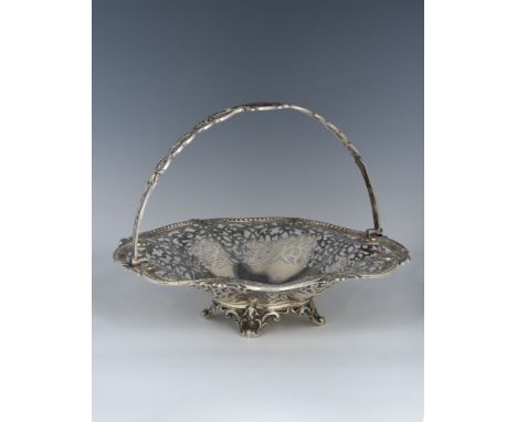 A late Victorian pierced silver swing handle basket centrepiece, Henry Statford, London, 1897, of shaped circular form with b