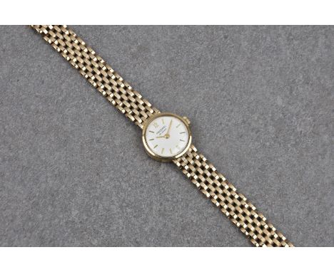A Record de Luxe 9ct gold ladies bracelet watch, manual wind, silvered 16mm. dial with gilt batons and Arabic numerals at 12 