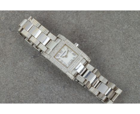 A Bucherer 'Pathos' 18ct white gold and diamond ladies quartz wrist watch, ref. 125-003, the square mother-of-pearl dial with