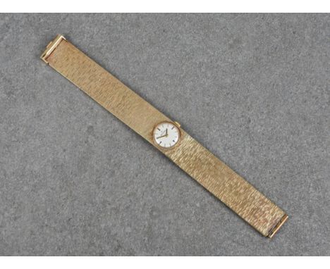 A vintage 9ct gold ladies Rodania manual wind bracelet watch, hallmarked London 1969, the circular, 14mm. silvered dial with 