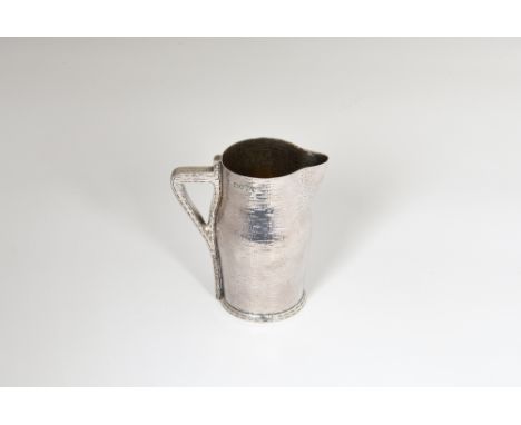 An extremely rare Victorian novelty silver cream jug, Edward Hutton, London 1887, modelled as a leather jack, faux stitched b