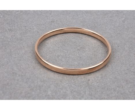 An antique hollow 9ct rose gold plain bangle, early 20th century, marked '9ct', 6.2cm. internal diameter.