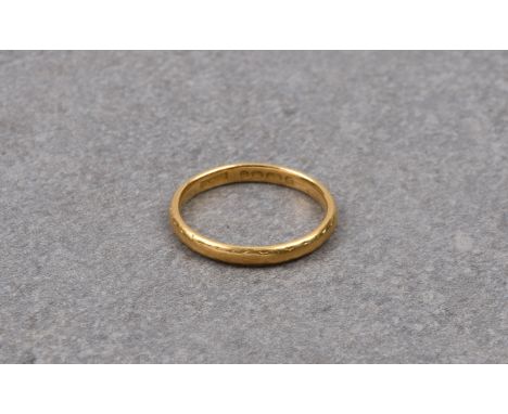 A 22ct yellow gold wedding band, W Wilkinson Ltd, London 1950, size K½.