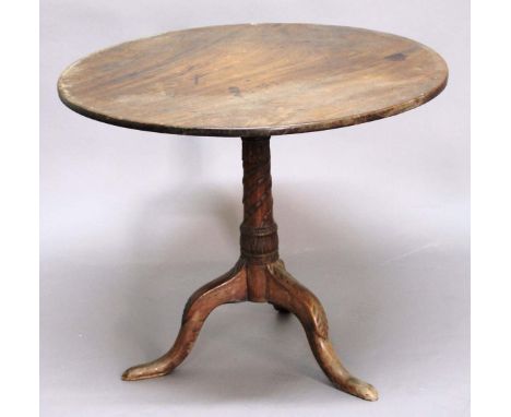 GEORGE III MAHOGANY TILT TOP BREAKFAST TABLE, late 18th century, the circular top on a column carved with fluting, stiff leav