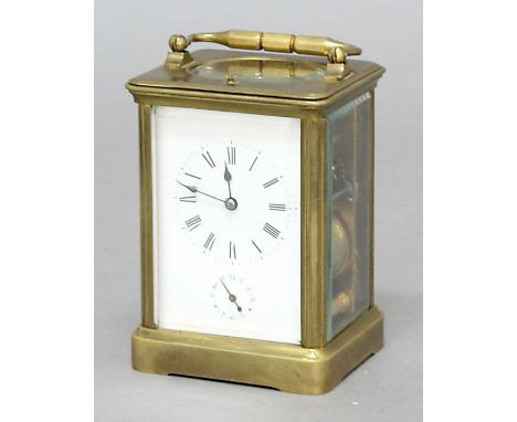 BRASS FOUR PANE CARRIAGE CLOCK, late 19th century, the enamelled dial with subsidiary alarm dial on a brass, eight day moveme