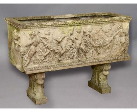 CAST STONE TROUGH, with cherubs amongst floral swags, on foliate stands, height 68cm, width 98cm, depth 37cm