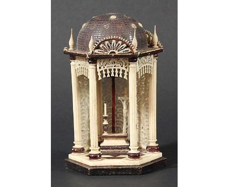 ANGLO-INDIAN IVORY TEMPLE, 19th century, the alter with a candlestick and crucifix before pierced screens, height 12cm