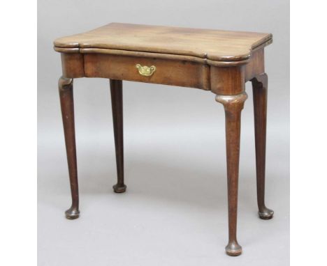 GEORGE II MAHOGANY FOLD OUT CARD TABLE, the shaped rectangular top enclosing coin trays and drink stands above a single drawe