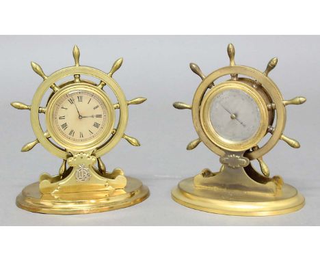 MATCHED PAIR OF BRASS SHIPS WHEEL CLOCK AND BAROMETER, with 2 1/2" dials, the clock with applied white metal initials and ret