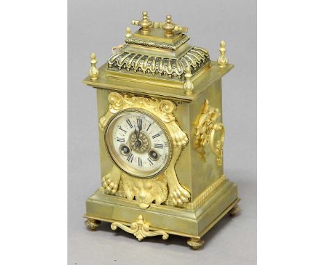FRENCH BRASS MANTEL CLOCK, the ivorine dial on a brass, eight day movement half hourly striking to a gong, the case with cadd