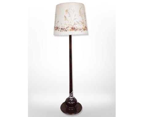 A mahogany standard lamp with floral shade, height 171 cm