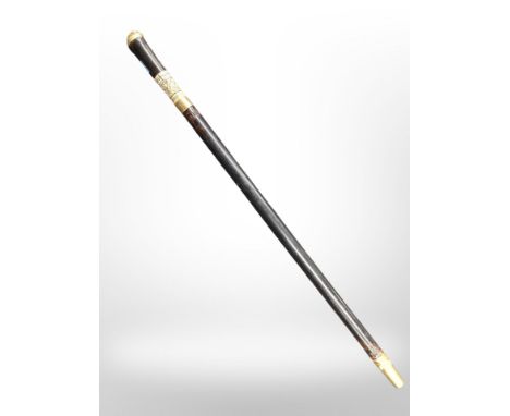 A sword stick in brass and bone-mounted wooden sheath, length 59cm.