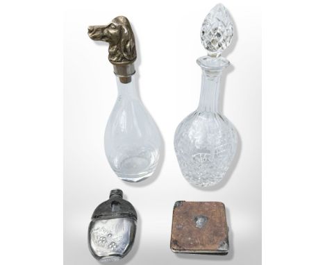 A glass decanter with cast brass stopper in the form of a Spaniel, height 31 cm, together with a further crystal decanter, hi