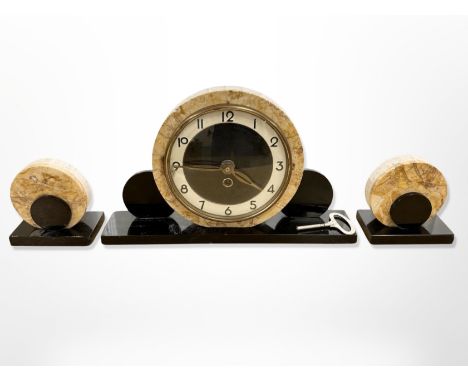 An Art Deco marble and polished slate three-piece clock garniture, clock 20cm high.
