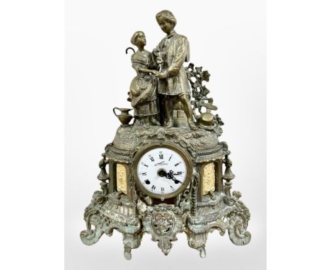 A 19th century patinated metal figural eight day mantel clock, striking on a bell, with key, height 45cm.  