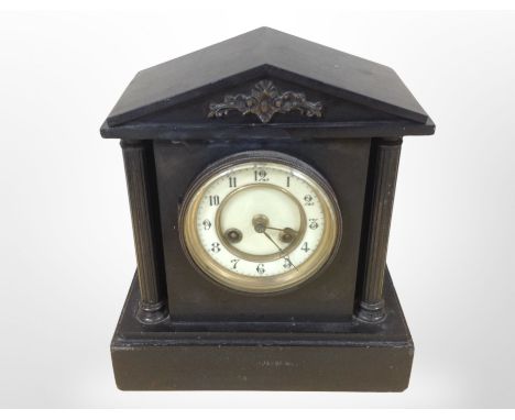 A Victorian black slate mantel clock with enamelled dial, height 28cm.