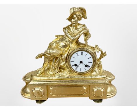 A 19th century gilt metal figural mantel clock, surmounted with a figure of Shakespeare, striking on a bell, with pendulum an