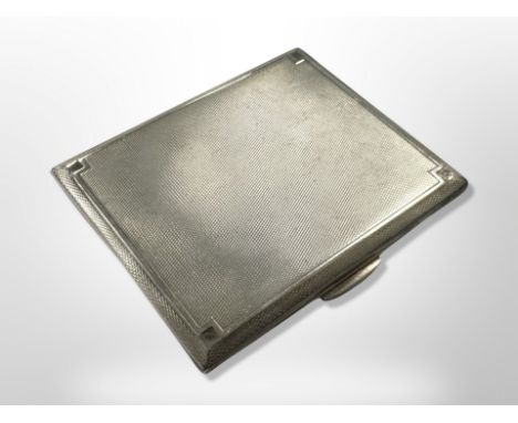 A George V silver cigarette case with engine-turned decoration, Smith & Bartlam, Birmingham 1935, width 8.5cm.  CONDITION REP