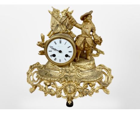 A 19th century French gilt metal figural mantel clock, striking on a bell, with pendulum and key, height 29cm. 