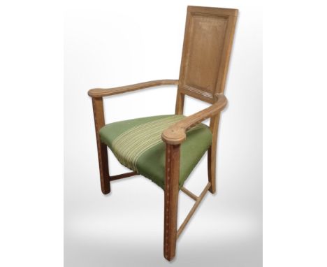 A continental carved oak panel back armchair, width 65 cm 