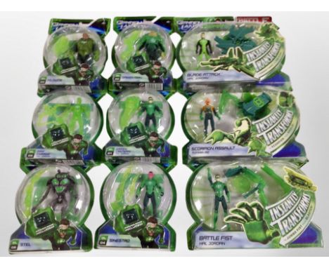 Nine Mattel Green Lantern figurines, boxed.